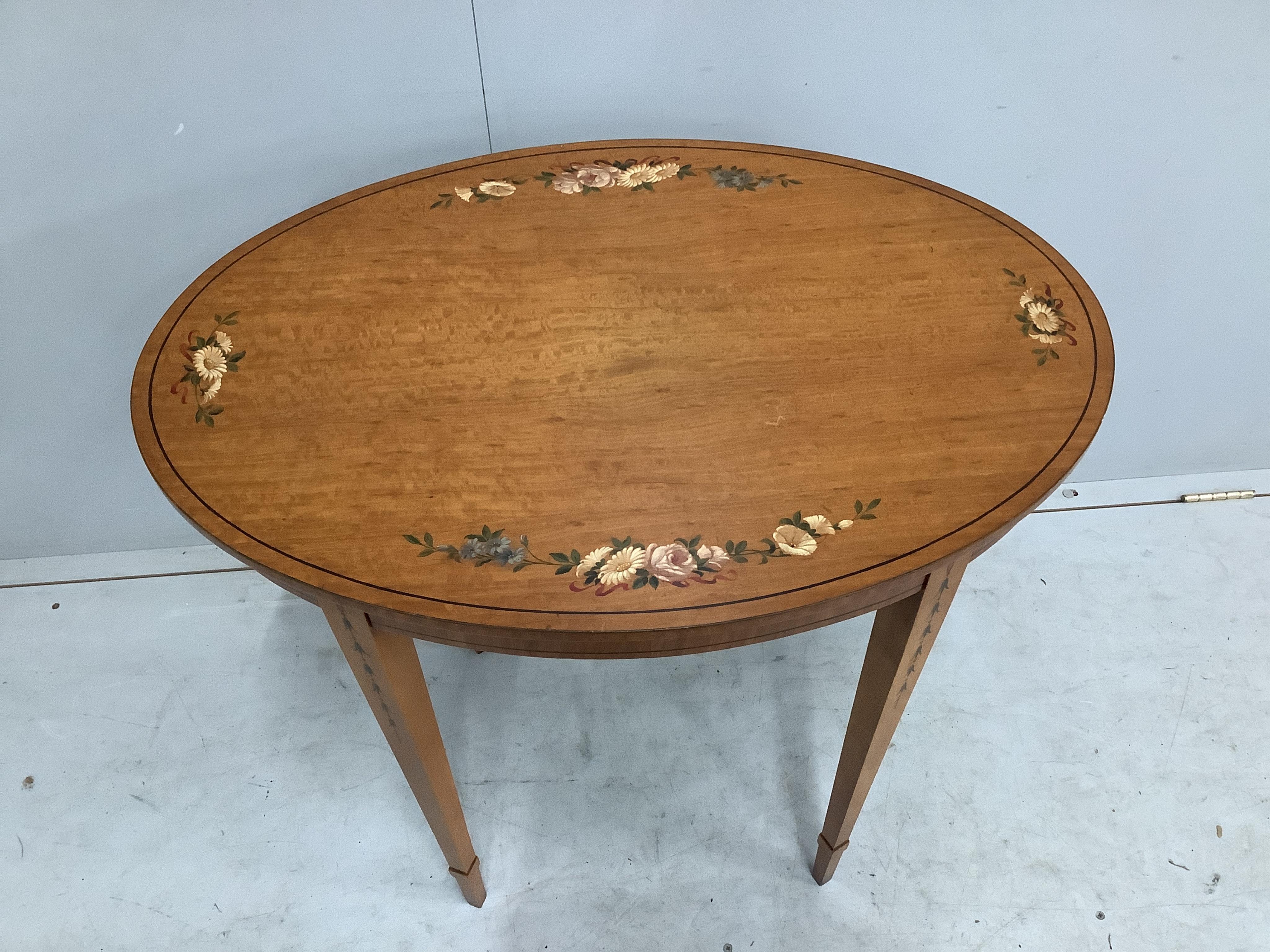 A pair of reproduction Sheraton style painted oval satinwood occasional tables, width 74cm, depth 52cm, height 74cm. Condition - good